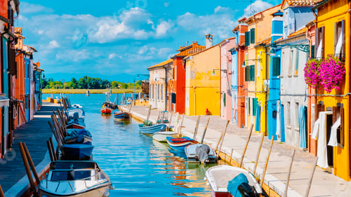 Preview: colorful streets of the village Burano Venice Italy colourful canal whit boats and vibrant house