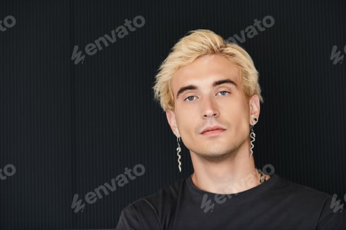 Preview: Young handsome man in stylish apartment enjoying a moment of bliss and confidence