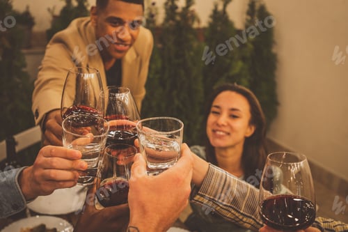 Preview: Family and friends celebrating at dinner on a rooftop terrace