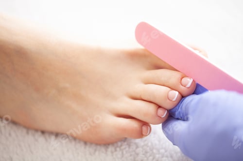 Preview: Close Up photo of a female feet at spa salon on pedicure procedure