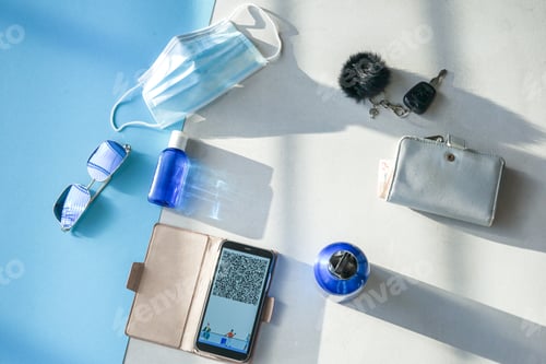 Preview: Travel items flat lay on blue and grey background