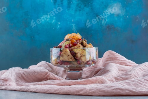 Preview: Fruit salad with chopped mix of foods in a glass cup