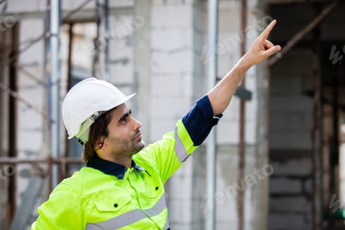 Preview: Close up man engineer builder house construction. male architect standing at home construction.