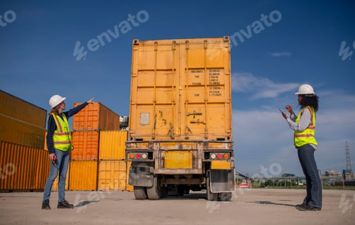 Preview: Engineer or dockworker working in the construction container dock yard checking and inspection conta