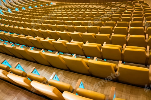 Preview: Row of empty seats in a theater.