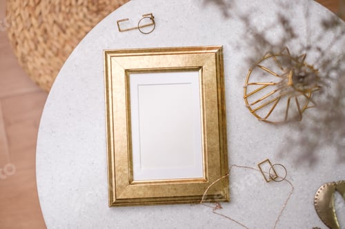 Preview: mockup gold photo frame on white stone round table with sunlight