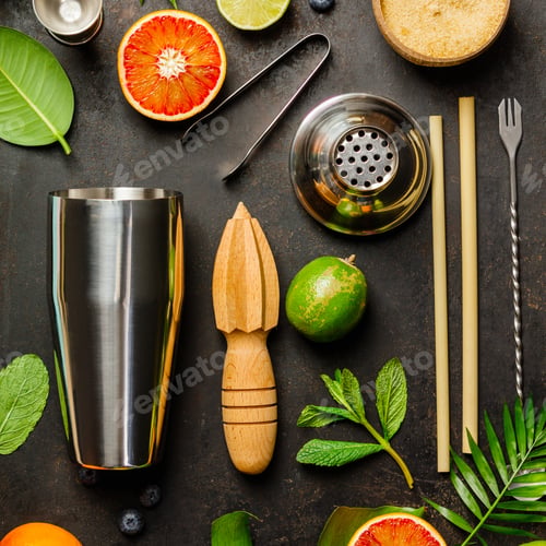 Preview: Cocktail making bar tools, shaker, tropical fruits and leaves