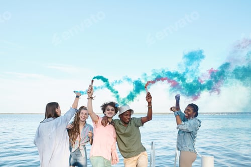Preview: Cheerful intercultural young friends dancing by waterside