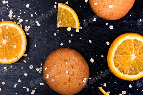 Preview: Oatmeal cookies and orange citrus fruit background. Flat lay