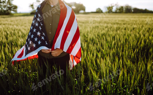 Preview: Man hold waving american USA flag. Patriot raise national american flag. Independence Day, 4th July.