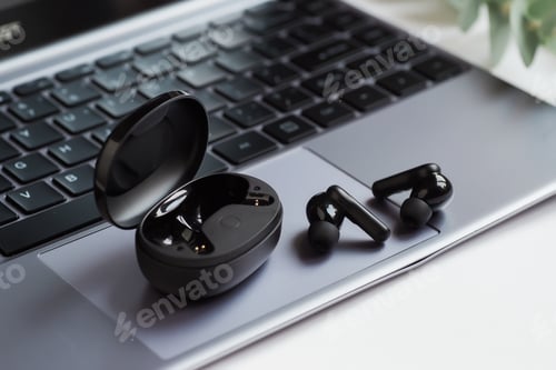 Preview: Wireless headphones on the laptop.