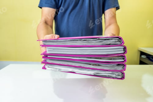 Preview: Man manager are filing account documents in front