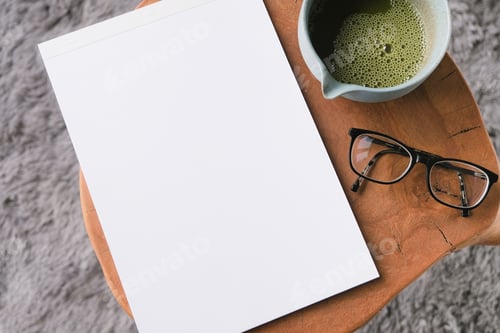 Preview: blank magazine mockup on coffee table with green matcha tea