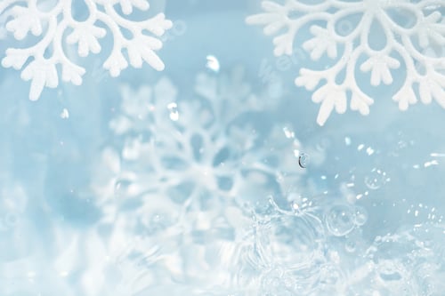 Preview: snowflake melts in water drops macro background
