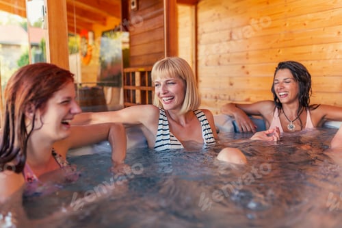 Preview: Girl friends relaxing in hot tub while on vacation