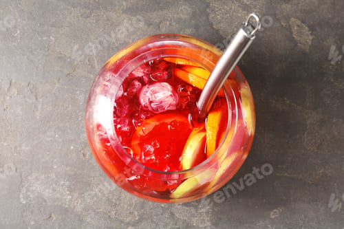 Preview: Fruity punch on grey table, top view. Refreshing drink