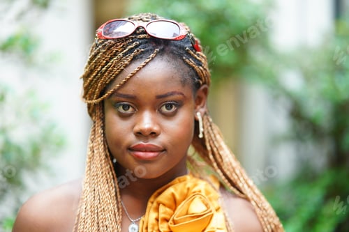 Preview: Portrait of attractive black skin young woman, Charming Afro girl. Portrait of afro girl looking at