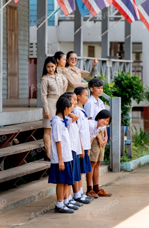 Preview: Vertical image of Asian students with uniform stand in a row in front of building