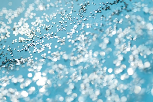 Preview: Glitter stars on blue background, sparkles of stars