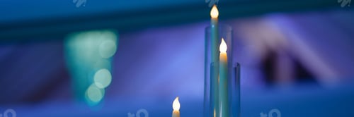 Preview: Banner elegant chandelier in a draped ceiling banquet hall.