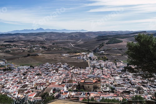 Preview: Aerial view of modern buildings near the mountains in Espera, Spain
