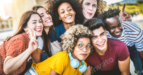 Preview: Multiethnic group of young people hugging standing together outside