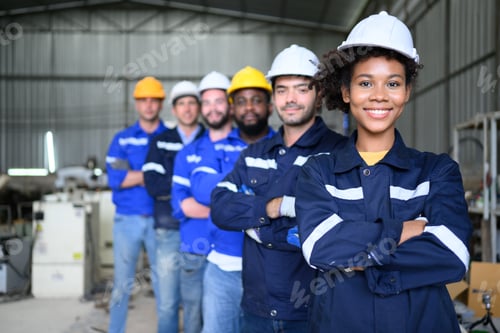 Preview: Group of confident worker team at factory