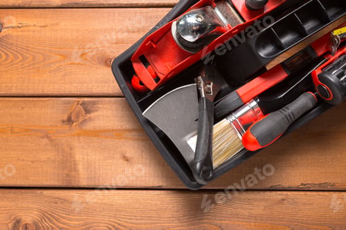 Preview: Assorted work tools on wood background
