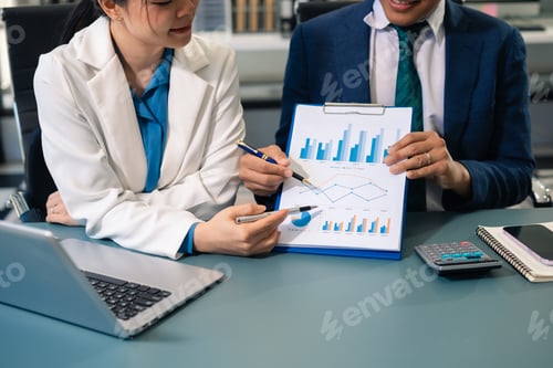 Preview: Business people discussing on performance revenue in meeting.