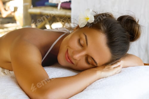 Preview: Young caucasian woman after traditional Thai massage
