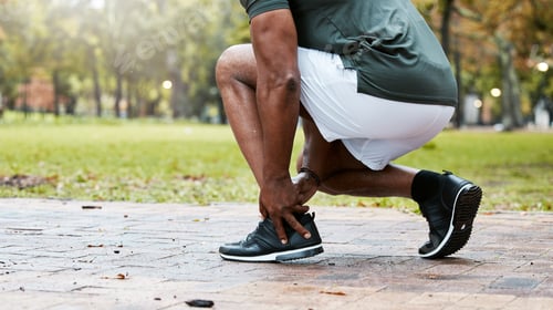 Preview: Sports, fitness runner or ankle pain on black man from exercise, training or wellness accident in p