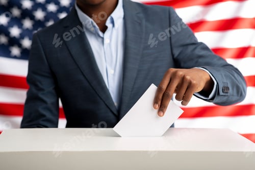 Preview: African american man holds envelope in hand above vote ballot
