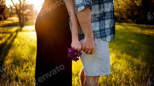 Preview: Pregnant girl with a young man holding hands