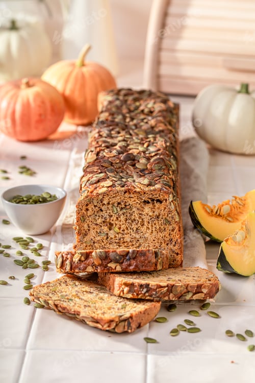Preview: Delicious pumpkin bread with orange squashes and seeds.