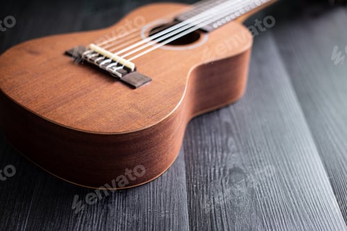 Preview: Ukulele on wooden tabletop