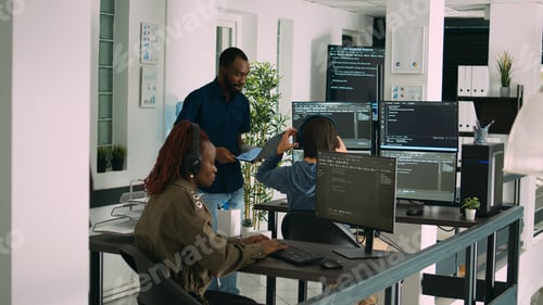 Preview: African american focused software engineer working on computer screen