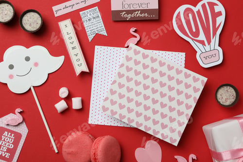 Preview: Valentine's Day accessories on red background, top view