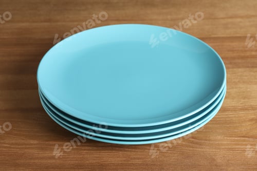 Preview: Elegant new empty plates on wooden table