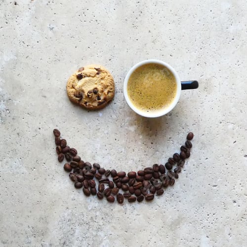 Preview: Smiley face made with coffee on stone table