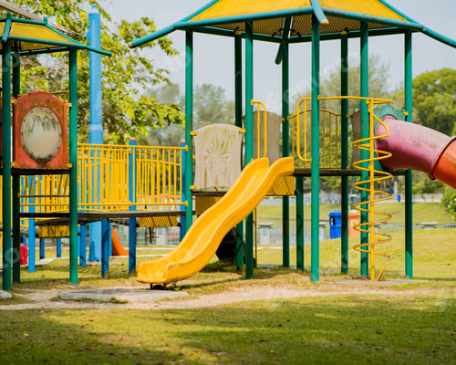 Preview: empty colourful playground in a sunny day