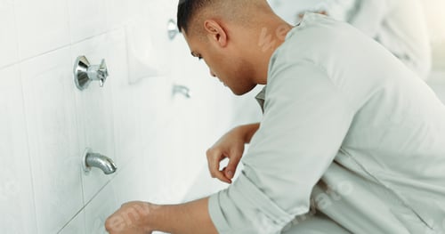 Preview: Muslim, religion and man ear washing for prayer in bathroom for purity, and cleaning ritual. Islami