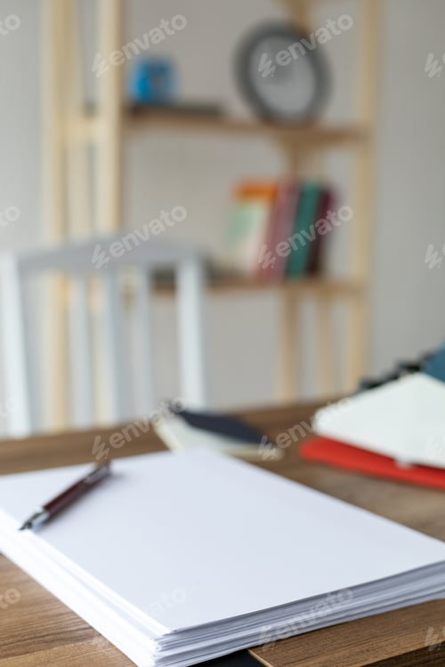 Preview: Sheet of paper on wood desk table. Office or study creative concept