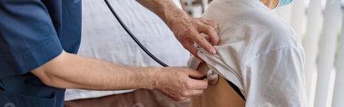 Preview: Close up of doctor listening to old woman's patient breathing, using stethoscope