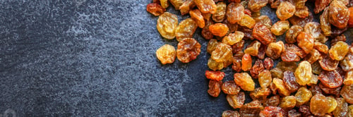 Preview: Raisins, Delicious Dried Grapes (Fresh Fruit Vitamins) Menu Concept Background. Top View. Copy Space
