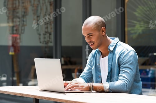 Preview: Man working on laptop