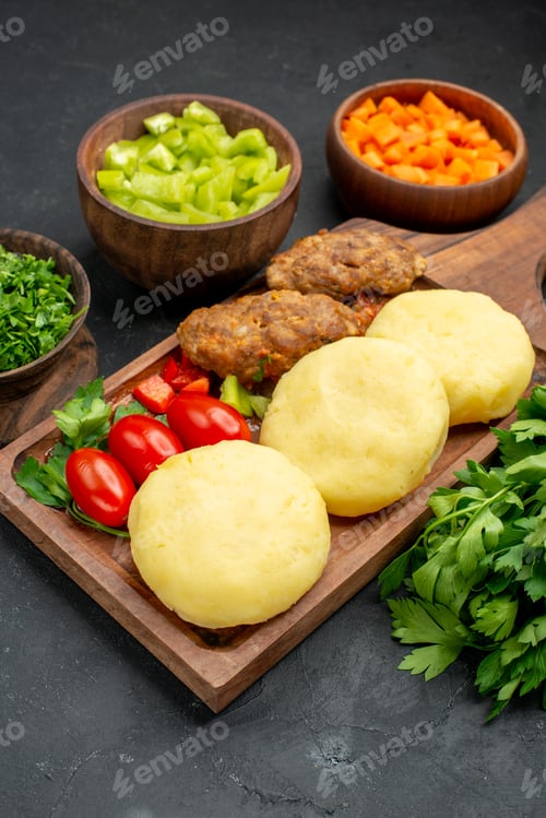 Preview: Top shop of dinner background with tasty cutlets vegetables and greens on dark background