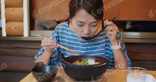 Preview: Woman eat with famous vegetable noodles in Kawaguchiko of Japan