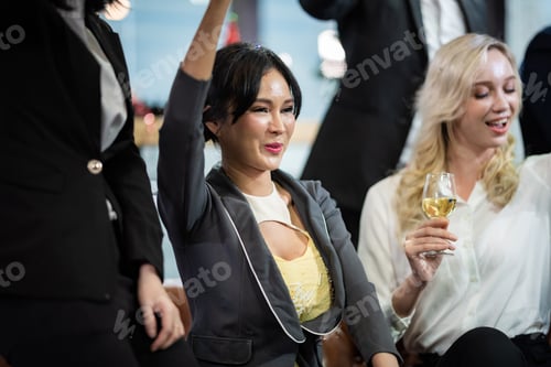 Preview: Toast to success. Group of business people toasting with champagne and smiling while