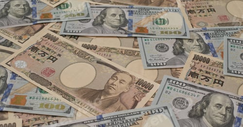 Preview: Stack of Japanese yen and USD