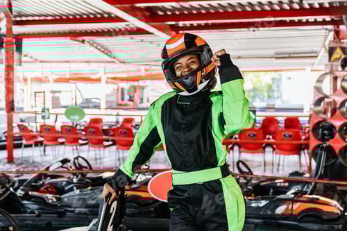 Preview: African woman celebrating victory at karting circuit